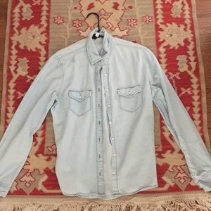 Women’s light wash button up denim shirt